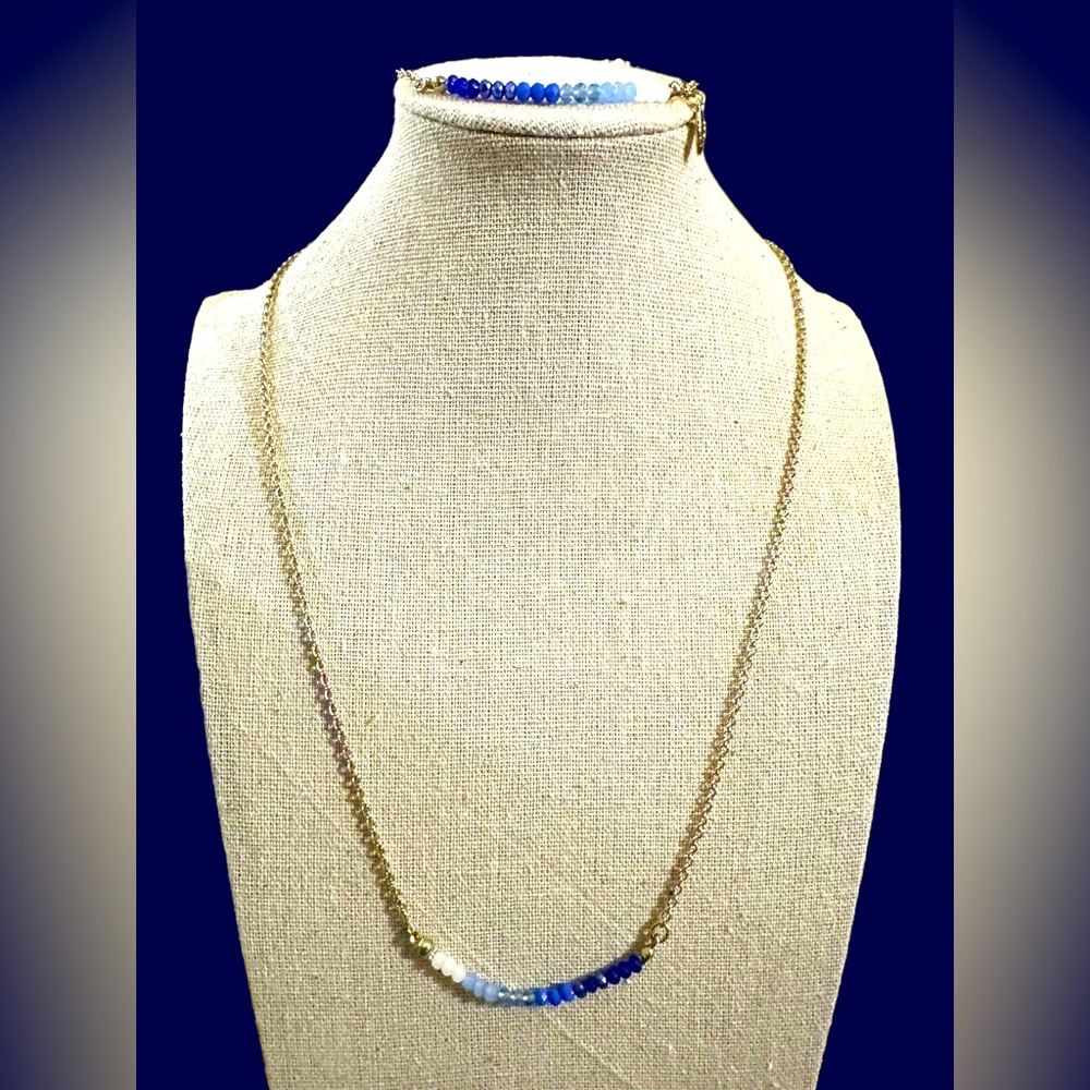 Avon gold tone with crystal beads in various blues to white “SHB” marked set